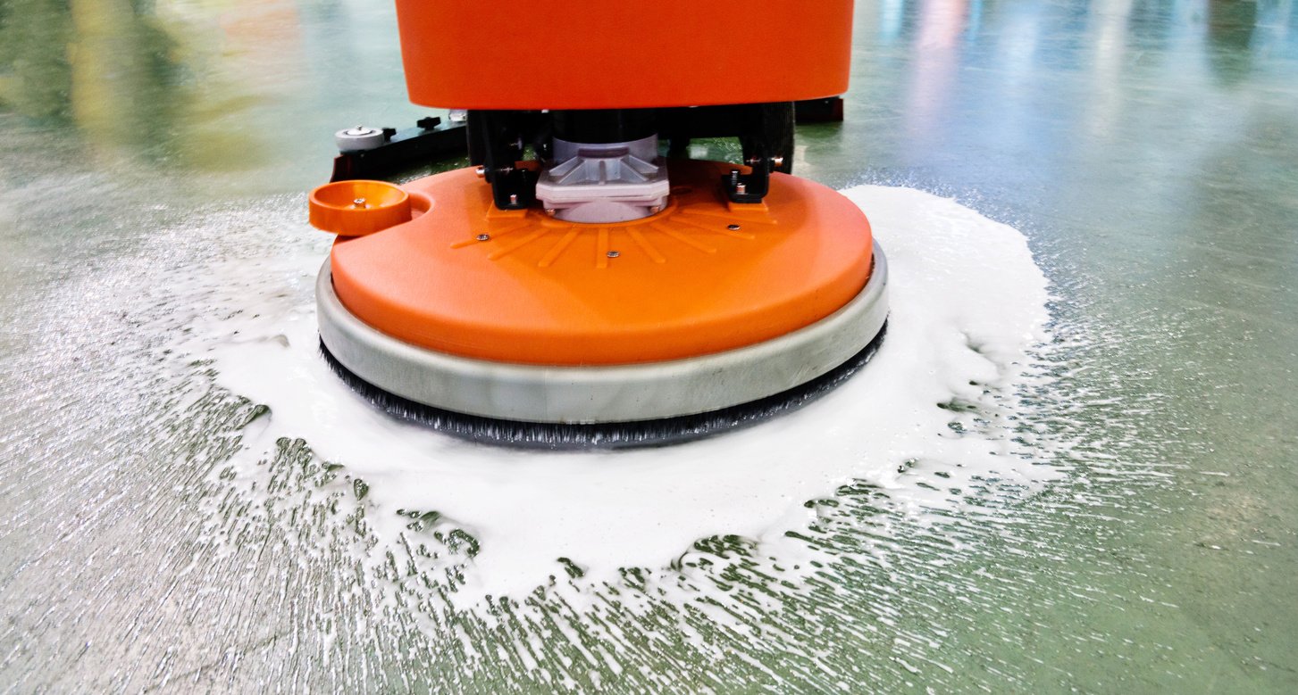 Cleaning floor with buffing machine