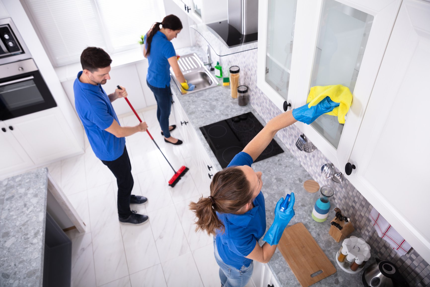 Janitors Cleaning Kitchen